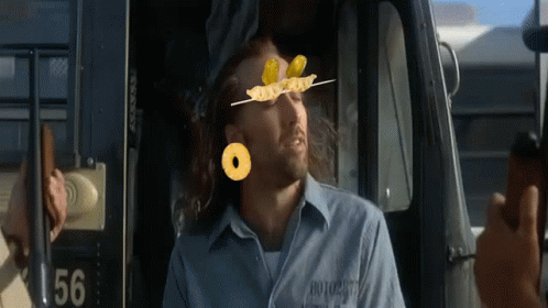 A Man In A Prison Uniform With The Number 56 On The Back GIF