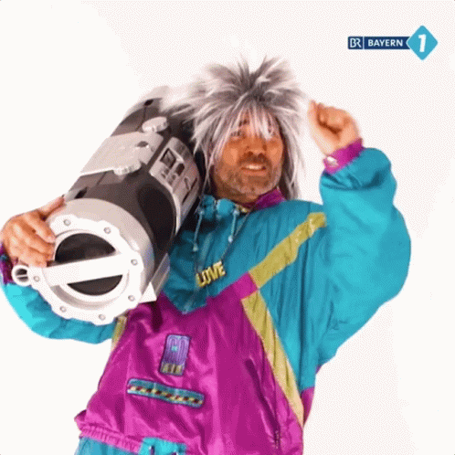 A Man In A Purple And Blue Jacket Is Holding A Boombox With Bayern 1 On The Bottom Right GIF