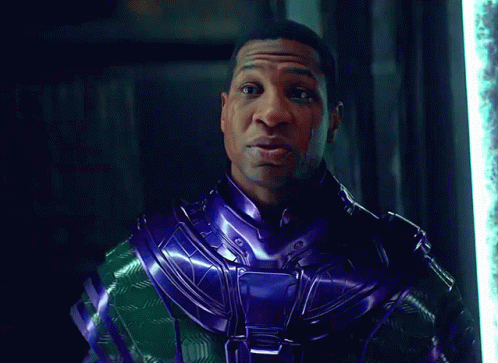 A Man In A Purple And Green Costume Says Time GIF