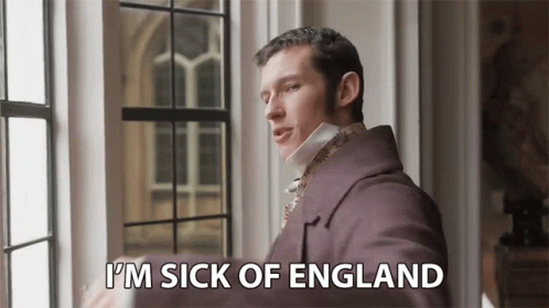 A Man In A Purple Coat Is Standing Next To A Window And Saying `` I 'M Sick Of England '' GIF