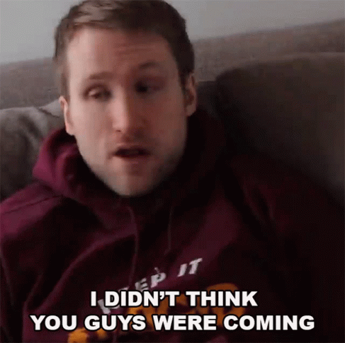 A Man In A Purple Hoodie Says " I Did N't Think You Guys Were Coming " While Sitting GIF