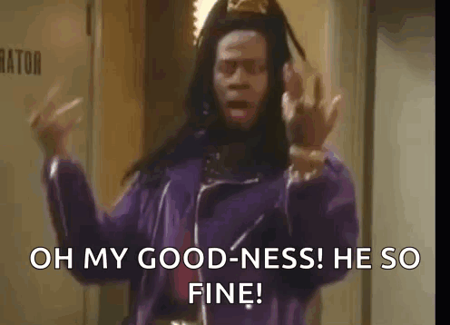 A Man In A Purple Jacket Is Standing In A Hallway And Says `` Oh My Goodness He So Fine '' GIF