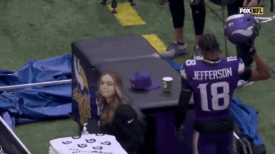 A Man In A Purple Jersey That Says Jefferson 18 GIF