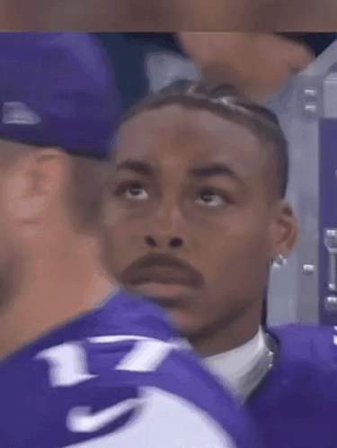 A Man In A Purple Jersey With The Number 7 On It GIF