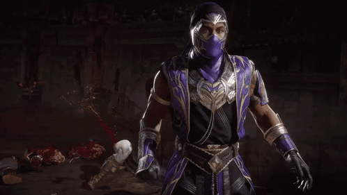 A Man In A Purple Mask Is Holding A Crystal Ball In His Hands . GIF