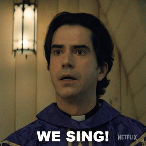 A Man In A Purple Robe Says " We Sing " In A Netflix Ad GIF