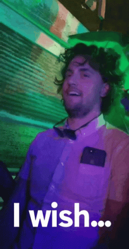 A Man In A Purple Shirt And Bow Tie Is Saying `` I Wish ... '' GIF
