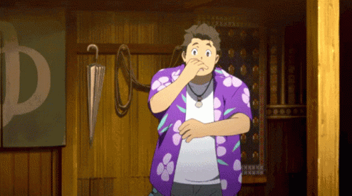 A Man In A Purple Shirt Is Covering His Nose In Front Of A Sign That Says D GIF