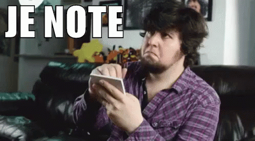 A Man In A Purple Shirt Is Sitting On A Couch Holding A Piece Of Paper With The Words Je Note On It . GIF