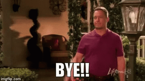 Man In Purple Shirt Saying Bye In Front Of Lamp Post GIF