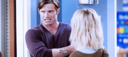 Man In Purple Shirt Talking To Woman Who Says Nope GIF