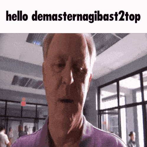 A Man In A Purple Shirt Says Hello Demasternagibast2top In Front Of A Building GIF