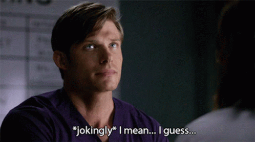 Man In Purple Shirt Saying Jokingly To Woman GIF