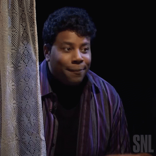 A Man In A Purple Shirt Says Nope In Front Of A Curtain GIF