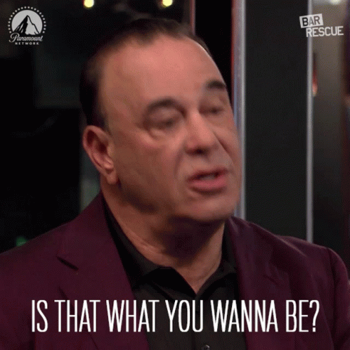 a man in a purple suit is asking is that what you wanna be