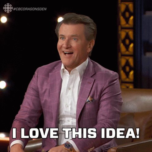 A Man In A Purple Suit Is Sitting In A Chair And Says I Love This Idea GIF