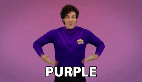 A Man In A Purple Sweater Says Purple GIF