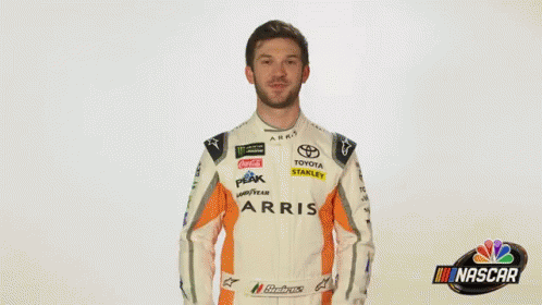 A Man In A Race Car Uniform Is Saying Wow . GIF