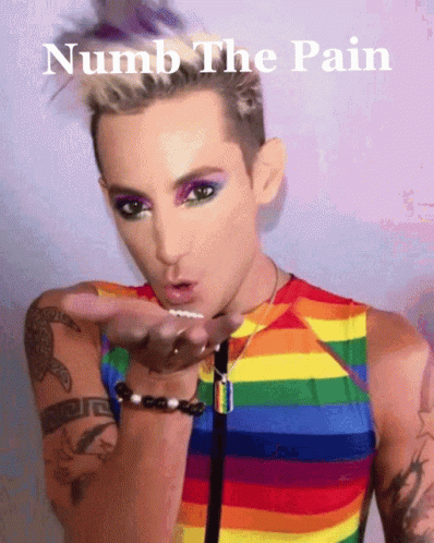 A Man In A Rainbow Shirt Blowing A Kiss With The Words Numb The Pain Below Him GIF
