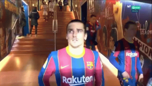 A Man In A Rakuten Jersey Is Standing In A Hallway GIF