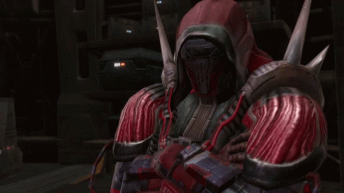 A Man In A Red And Black Armor With A Hood On His Head GIF
