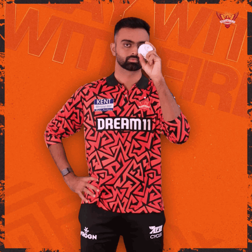A Man In A Red And Black Shirt That Says Dream11 On It GIF