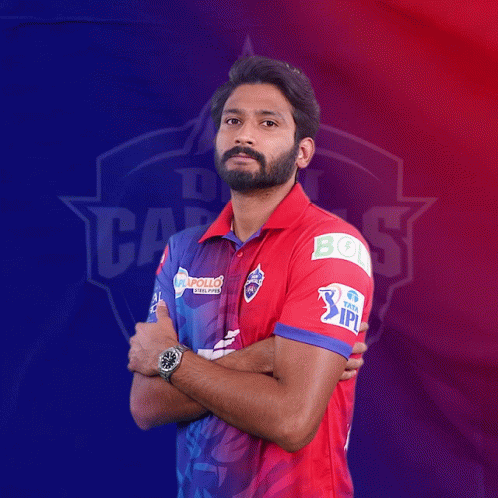 A Man In A Red And Blue Shirt With The Word Ipl On His Arm GIF