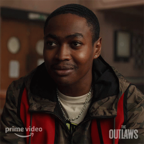 A Man In A Red And Brown Jacket With The Word Outlaws On It GIF