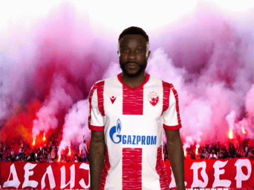 A Man In A Red And White Gazprom Jersey GIF