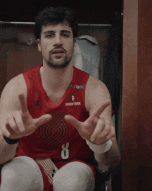 A Man In A Red Basketball Jersey With The Number 8 On It GIF