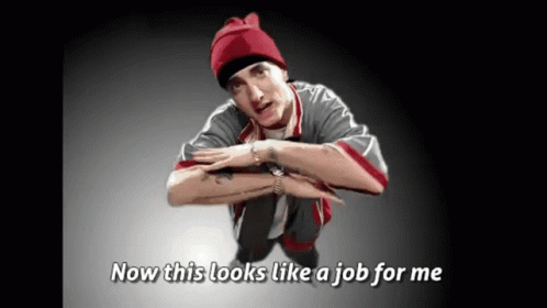 A Man In A Red Beanie Is Squatting Down With The Words Now This Looks Like A Job For Me Below Him GIF