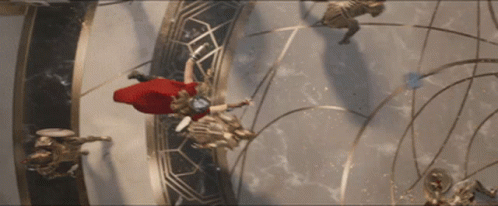 a man in a red cape is flying through a circle