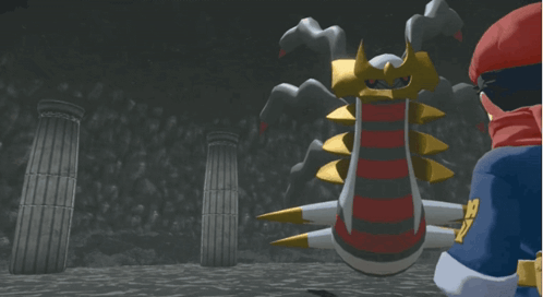 A Man In A Red Cape Stands In Front Of A Giant Monster GIF