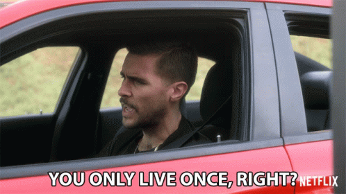 A Man In A Red Car Says " You Only Live Once Right ? " GIF