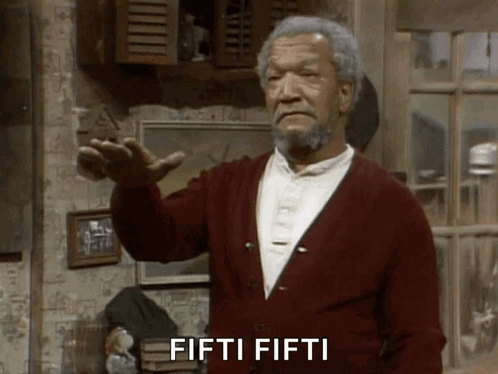 A Man In A Red Cardigan Says Fifti Fifti In Front Of A Window GIF