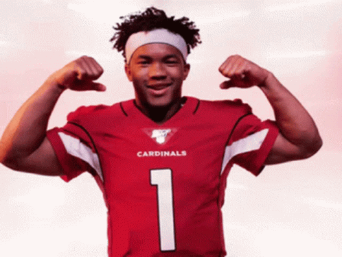 A Man In A Red Cardinals Jersey Flexes His Arms GIF