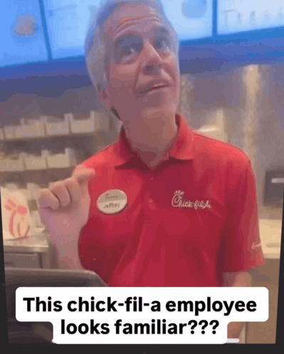 A Man In A Red Chick-Fil-A Shirt Is Pointing At Something GIF