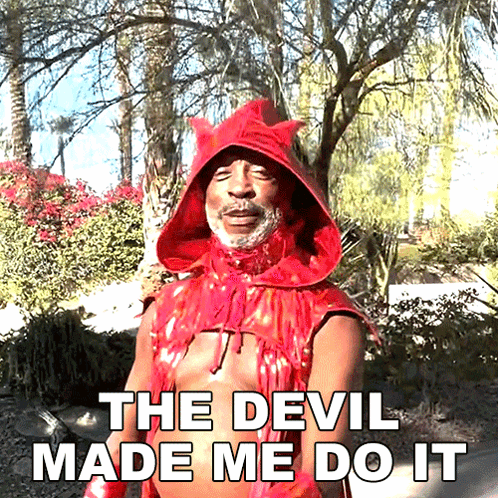 A Man In A Red Devil Costume With The Words The Devil Made Me Do It Below Him GIF