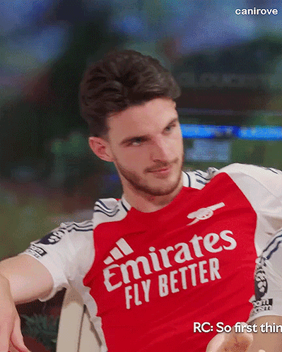 A Man In A Red Emirates Fly Better Shirt GIF