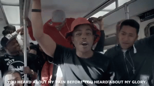 A Man In A Red Hat Is Riding A Subway With The Words You Heard About My Pain Before You Heard About My Glory GIF
