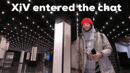 A Man In A Red Hat Is Standing In Front Of A Ceiling With Lights And The Words Xiv Entered The Chat Above Him . GIF