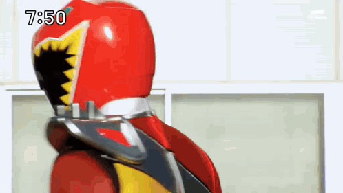 A Man In A Red Helmet Is Standing In Front Of A Window With The Time 7:50 GIF