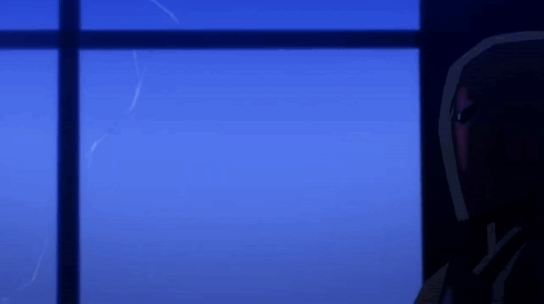 A Man In A Red Helmet Looks Out A Window At Night GIF