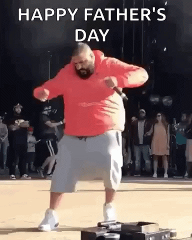 A Man In A Red Hoodie And Shorts Is Dancing In Front Of A Crowd On Father 'S Day . GIF