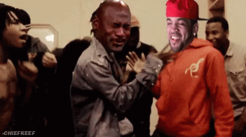 A Man In A Red Hoodie Is Standing Next To A Man In A Grey Jacket GIF