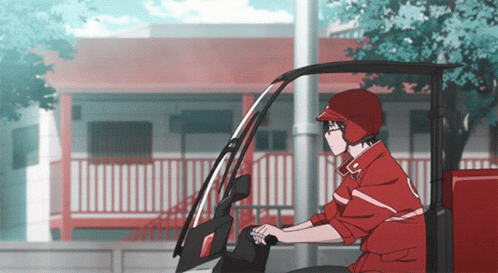 A Man In A Red Jacket And Helmet Is Driving A Red Vehicle GIF