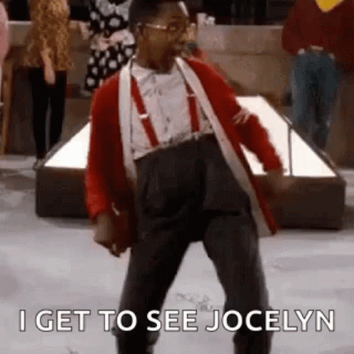 A Man In A Red Jacket And Suspenders Is Dancing In Front Of A Crowd . GIF