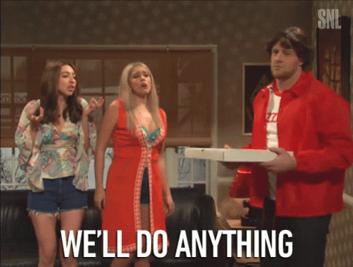 A Man In A Red Jacket Holding A Pizza Box Says We 'Ll Do Anything In Front Of Two Women GIF