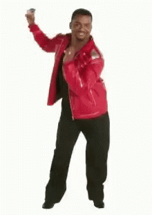 A Man In A Red Jacket Is Dancing In Front Of A White Background . GIF