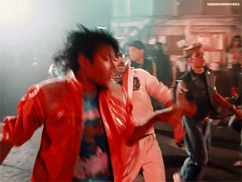 A Man In A Red Jacket Is Dancing With A Man In A White Shirt And A Man In A Black Jacket GIF
